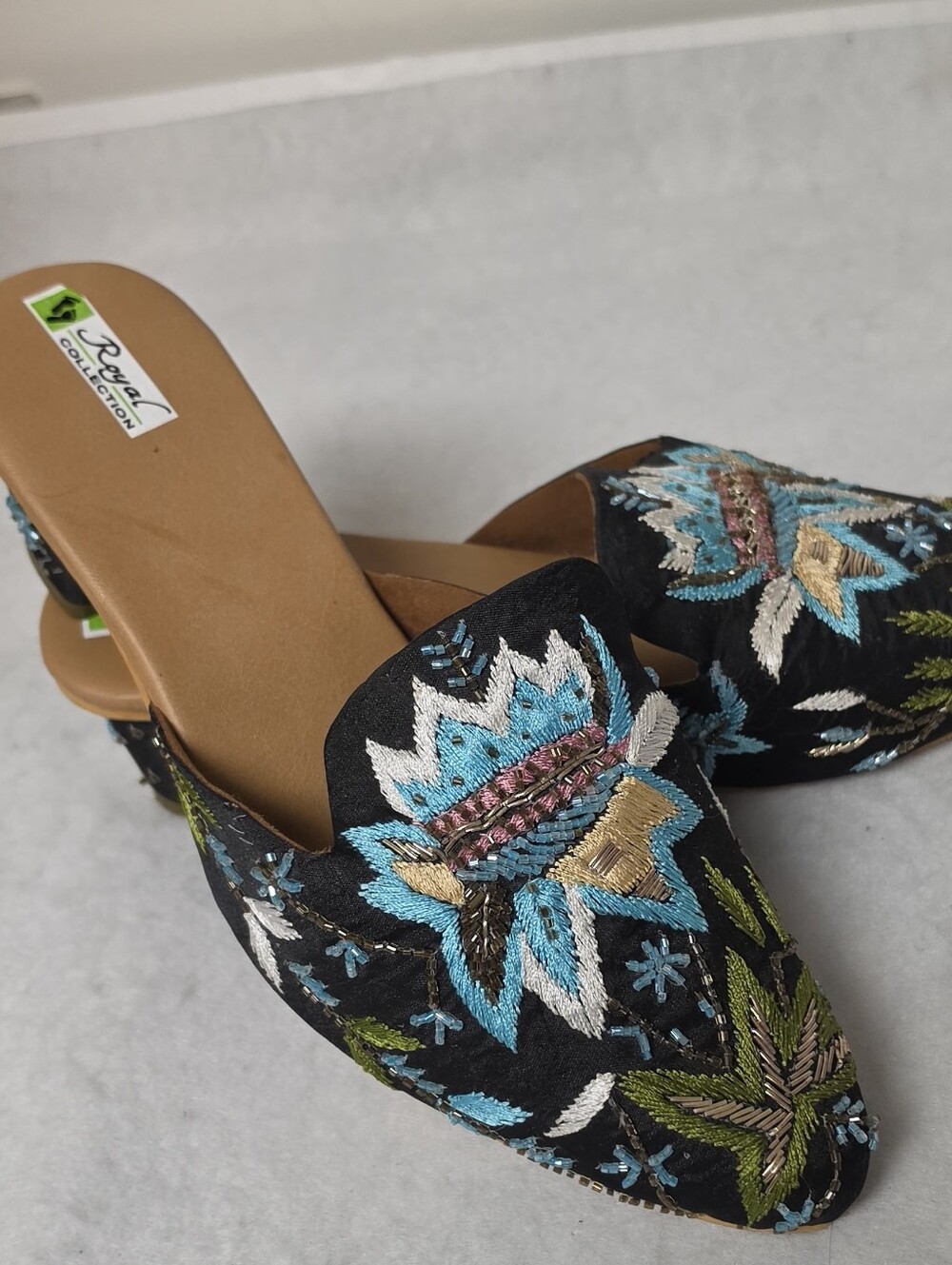 Embroidered Slip-On Mules in Black with Blue Floral Accents